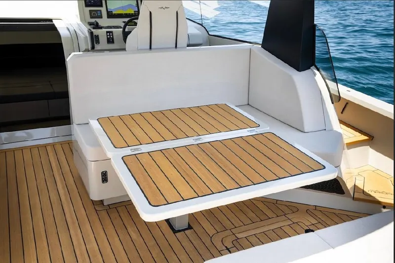 Slide: The Image of Luxury deck of 2025 Maori 54ft XL yacht with sleek wooden finish. - 13