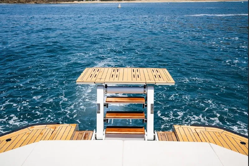 Slide: The Image of Luxury Maori 54ft XL yacht with wooden deck and swim platform, 2025 model, on open sea. - 15