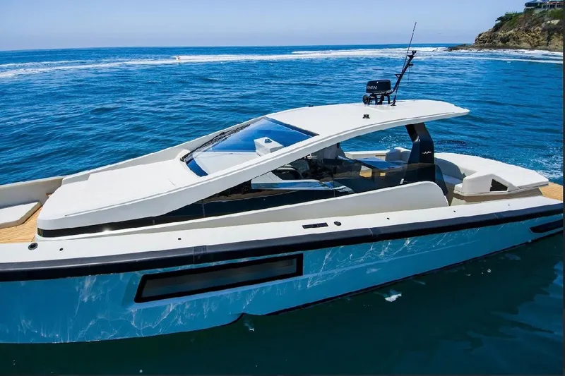 Slide: The Image of 2025 Maori 54ft XL yacht cruising on blue ocean waters. - 2