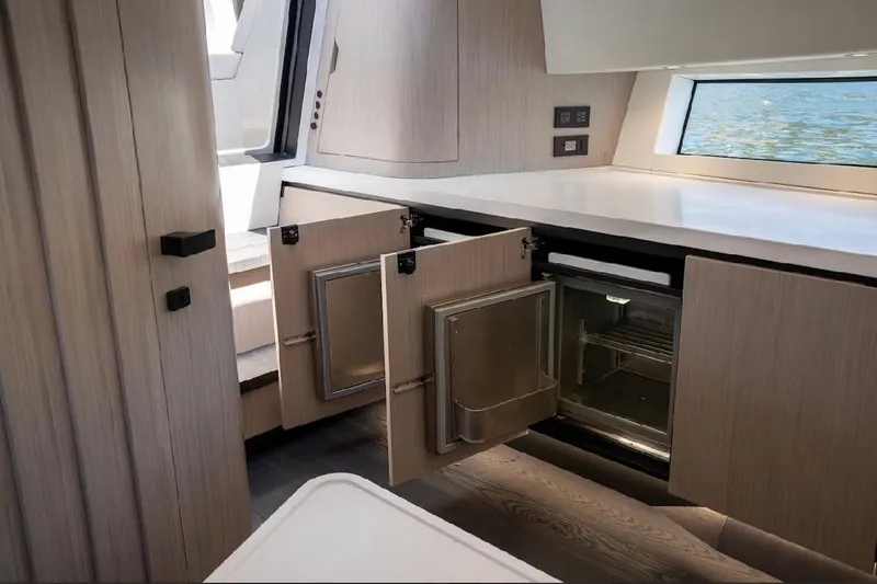Slide: The Image of Modern kitchen interior of 2025 Maori 54ft XL yacht with open cabinets and sleek design. - 21