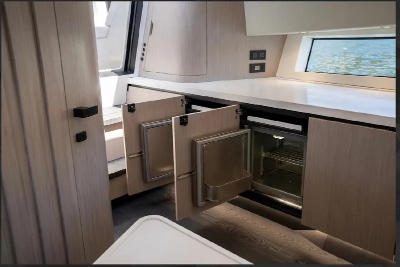 Slide: The Image of Modern kitchen interior of 2025 Maori 54ft XL yacht with open cabinets and sleek design. - 24