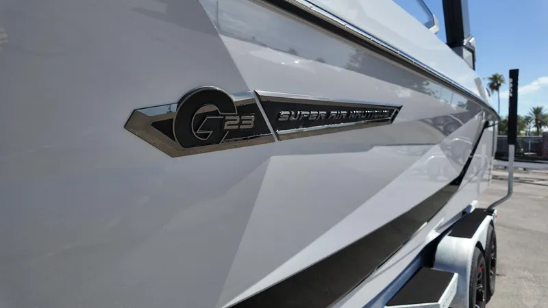Slide: The Image of 2026 Nautique Paragon G23 boat side view with logo detail. - 11
