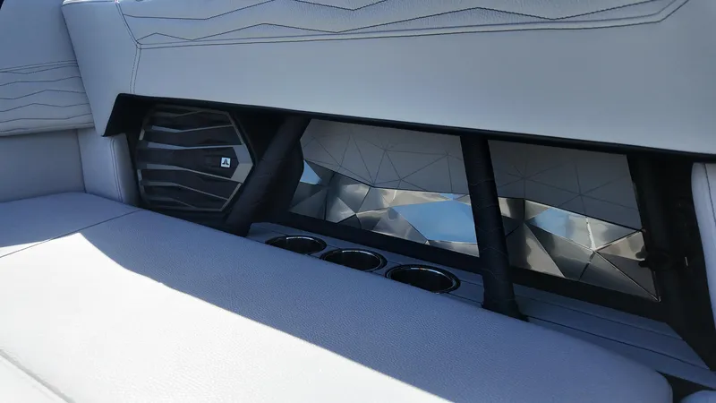 Slide: The Image of 2026 Nautique Paragon G23 interior with speaker and cup holders. - 13