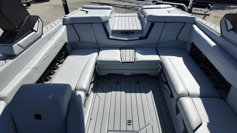 Slide: The Image of 2026 Nautique Paragon G23 interior with luxurious gray seating and modern design. - 18