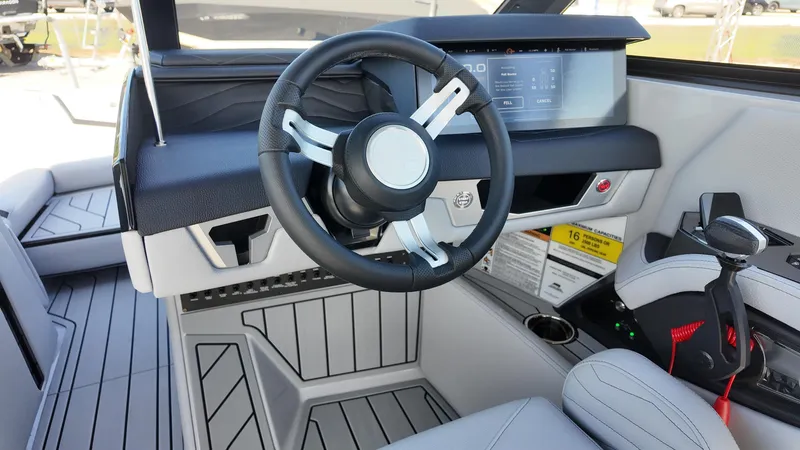 Slide: The Image of 2026 Nautique Paragon G23 helm with modern steering wheel and digital display. - 20