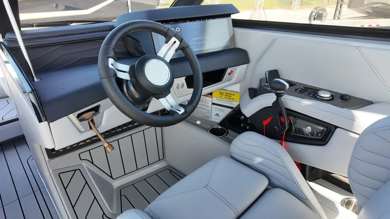 Slide: The Image of 2026 Nautique Paragon G23 helm with modern steering wheel and control panel. - 3