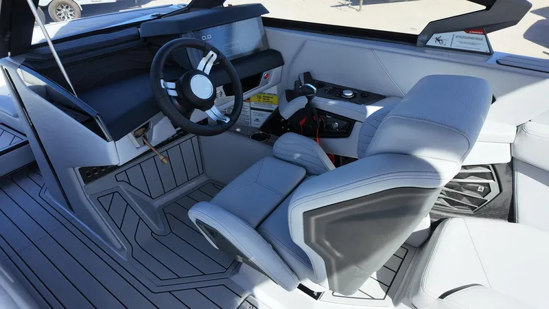Slide: The Image of 2026 Nautique Paragon G23 cockpit with modern steering and luxurious seating. - 4
