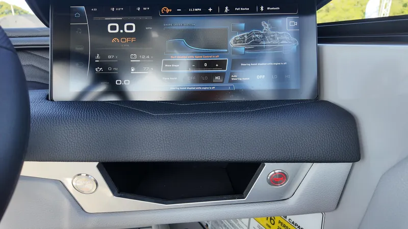 Slide: The Image of 2026 Nautique Paragon G23 dashboard with digital display and control panel. - 5