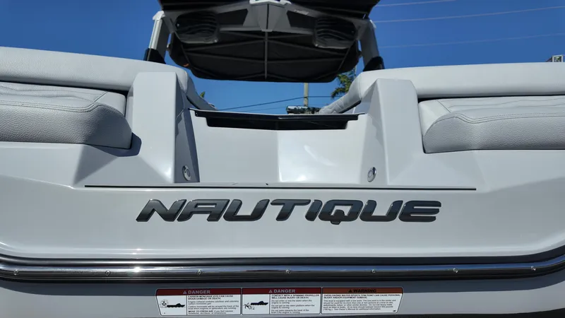 Slide: The Image of 2026 Nautique Paragon G23 boat, rear view, showcasing sleek design and branding. - 7