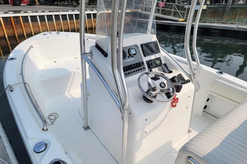 Slide: The Image of Laguna C210SC boat interior with steering console, 2018 G2 150 HP engine warranty until 2028. - 10