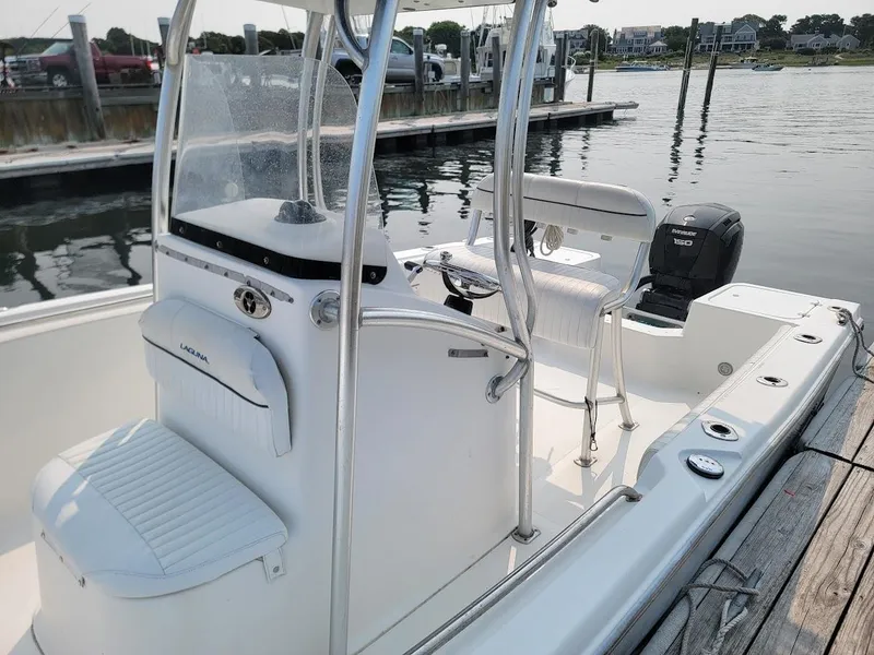 Slide: The Image of 2007 Laguna C210SC boat with 2018 G2 150 HP engine, docked at marina. - 11