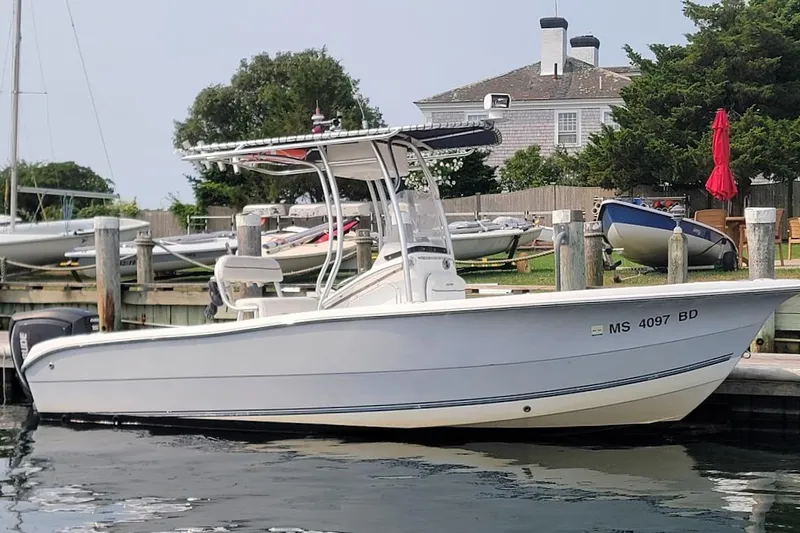 Slide: The Image of 2007 Laguna C210SC boat docked, featuring 2018 G2 150 HP engine, warranty until 2028. - 14