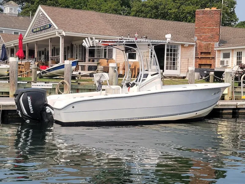 Slide: The Image of Laguna C210SC boat docked at a marina, featuring 2018 G2 150 HP engine. - 3
