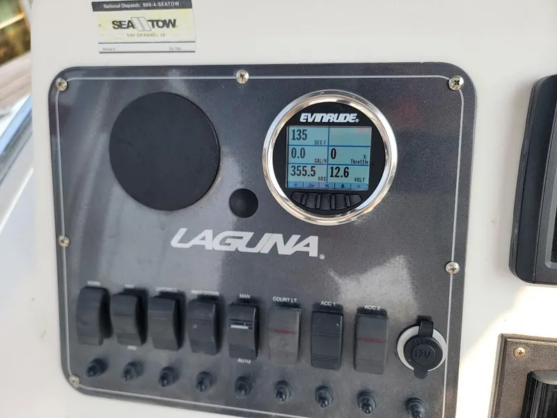 Slide: The Image of Control panel of 2007 Laguna C210SC boat with Evinrude display and switches. - 4