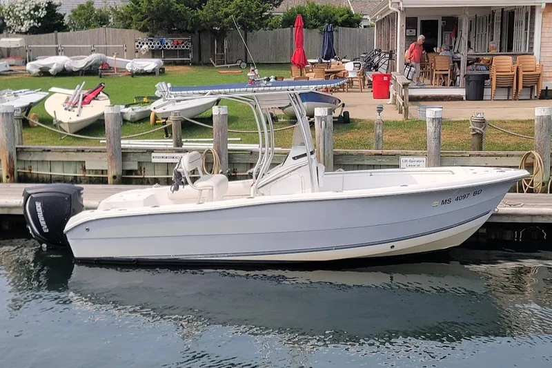 Slide: The Image of 2007 Laguna C210SC boat docked, featuring 2018 G2 150 HP engine, warranty until 2028. - 9