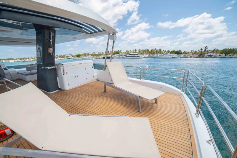 Slide: The Image of Luxury deck of 2018 Sirena 64 yacht with sun loungers and ocean view. - 23