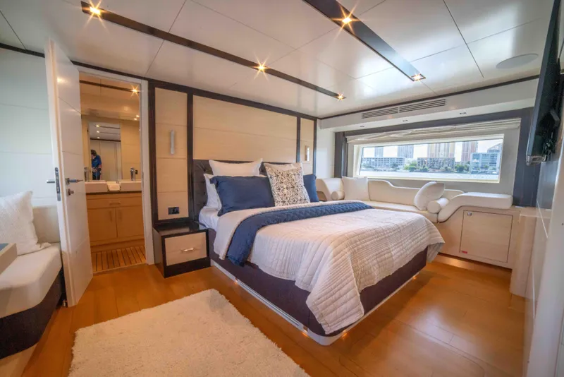 Slide: The Image of Luxurious bedroom interior of 2018 Sirena 64 yacht with modern decor and large window. - 44