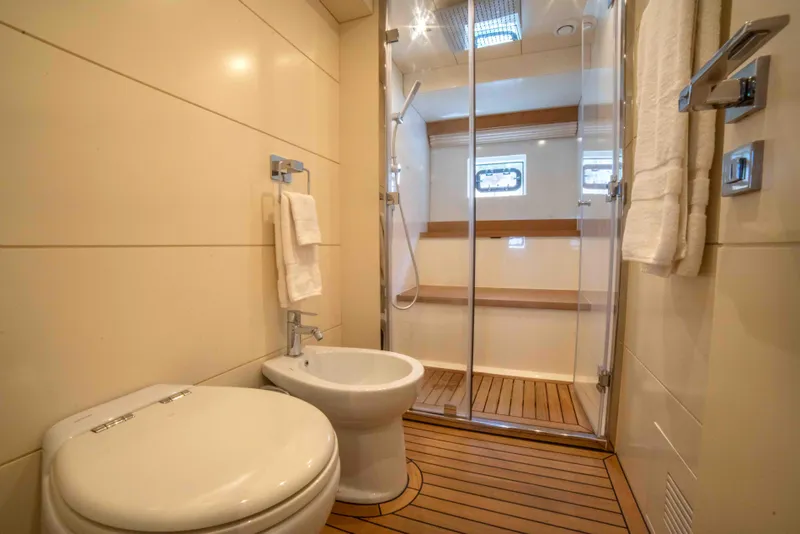 Slide: The Image of Luxurious bathroom in 2018 Sirena 64 yacht with shower, toilet, and bidet. - 49