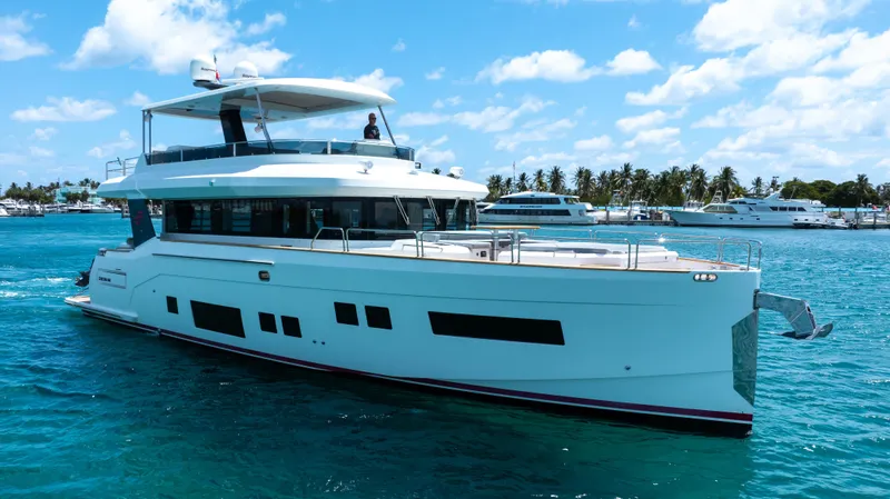 Slide: The Image of 2018 Sirena 64 yacht cruising in clear blue waters. - 5