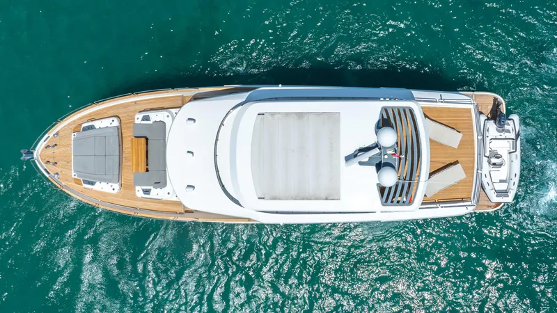 Slide: The Image of Aerial view of 2018 Sirena 64 yacht cruising on turquoise waters. - 6