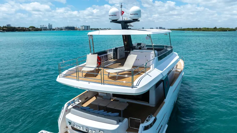 Slide: The Image of 2018 Sirena 64 yacht cruising on turquoise waters. - 7