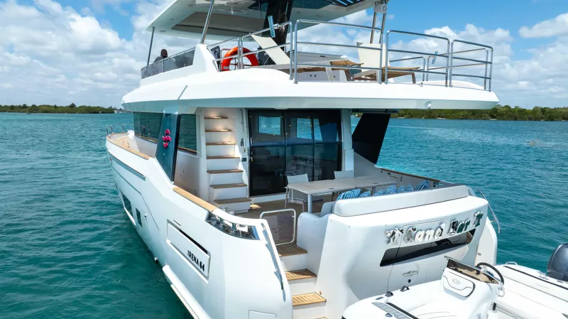 Slide: The Image of 2018 Sirena 64 yacht on open water, rear view. - 8