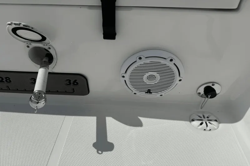 Slide: The Image of 2023 Sea Hunt 234 Ultra boat interior with speaker and fishing rod holder. - 10