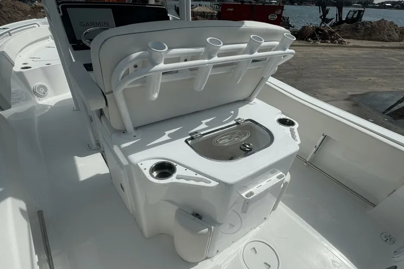 Slide: The Image of 2023 Sea Hunt 234 Ultra boat interior with rod holders and Garmin equipment. - 11