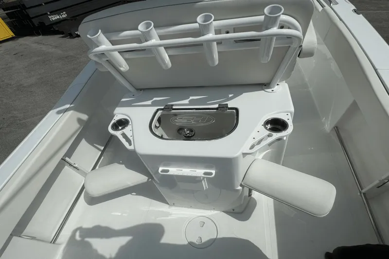 Slide: The Image of 2023 Sea Hunt 234 Ultra boat interior with rod holders and seating. - 12