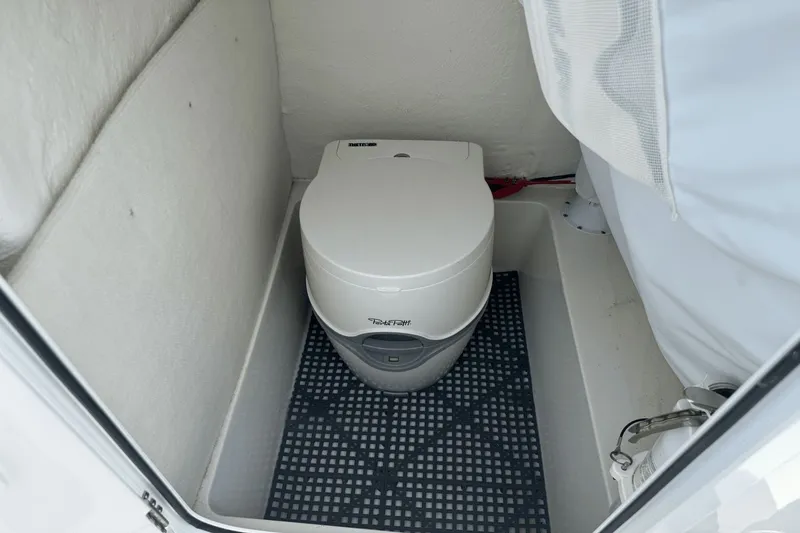 Slide: The Image of Compact marine toilet in 2023 Sea Hunt 234 Ultra boat cabin. - 25
