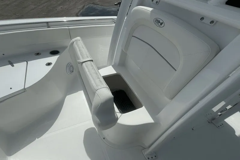 Slide: The Image of 2023 Sea Hunt 234 Ultra boat interior seating and storage compartment. - 26