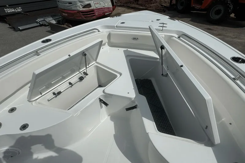 Slide: The Image of 2023 Sea Hunt 234 Ultra boat with open storage compartments on deck. - 30