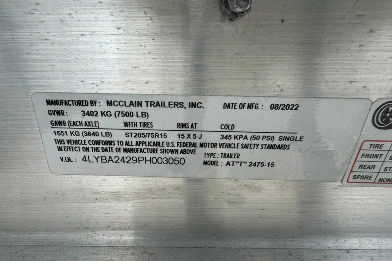 Slide: The Image of Label on McClain trailer showing specifications and compliance details, manufactured in August 2022. - 33