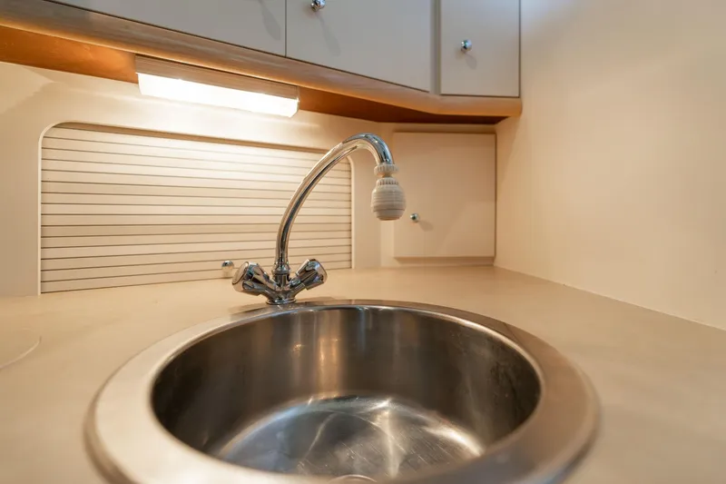 Slide: The Image of Stainless steel sink in 1998 Carver 355 Aft Cabin yacht kitchen. - 18