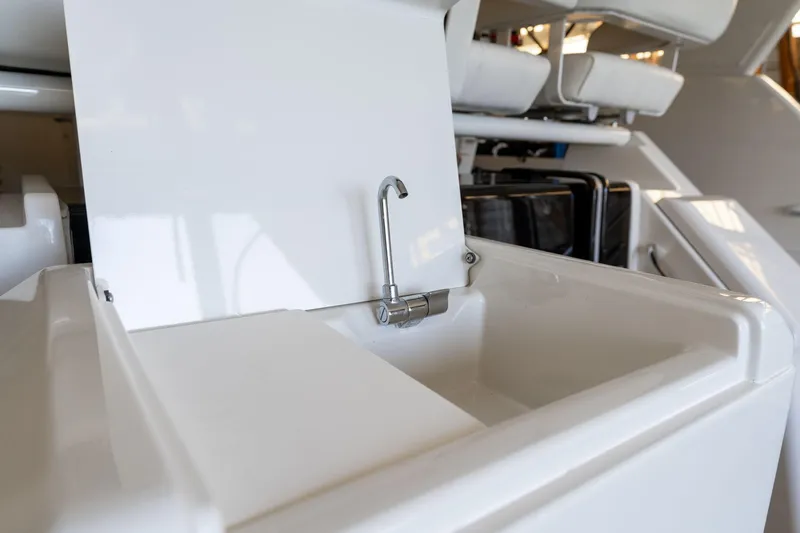 Slide: The Image of 1998 Carver 355 Aft Cabin yacht sink with faucet, white interior detail. - 30