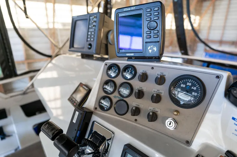 Slide: The Image of Control panel of 1998 Carver 355 Aft Cabin with GPS and gauges. - 35