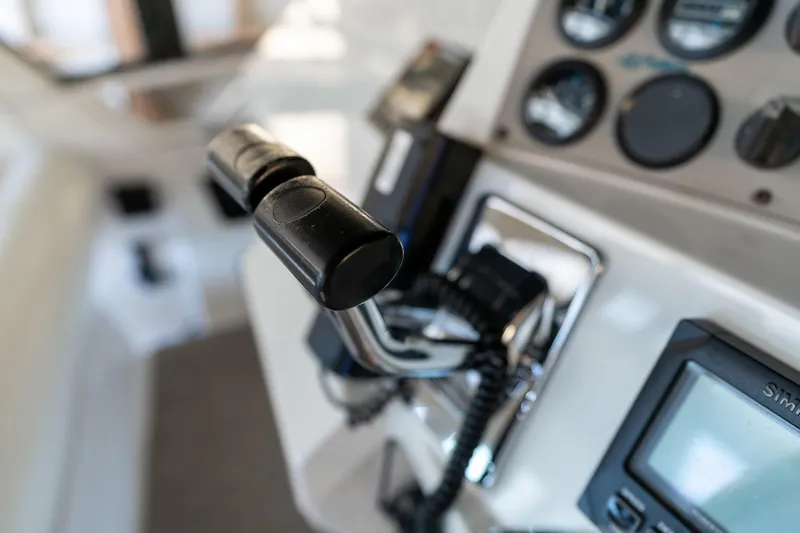 Slide: The Image of Close-up of 1998 Carver 355 Aft Cabin boat controls and dashboard instruments. - 36