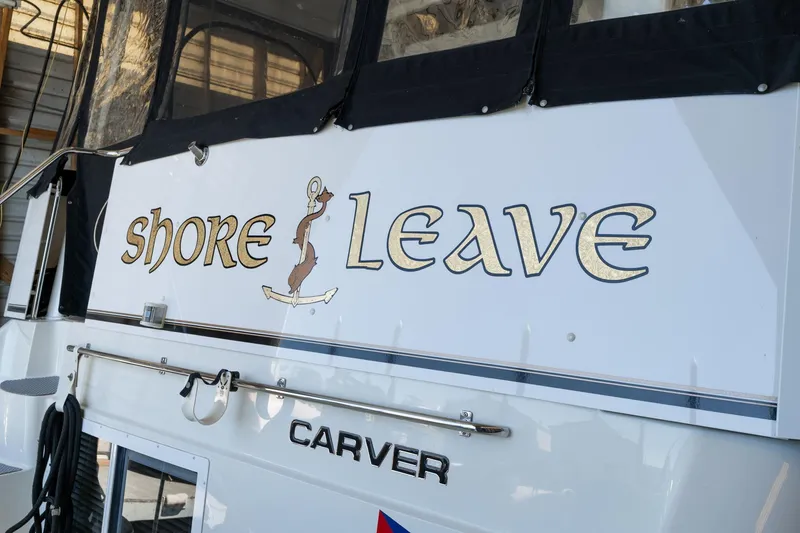 Slide: The Image of 1998 Carver 355 Aft Cabin boat with "Shore Leave" name on the stern. - 4