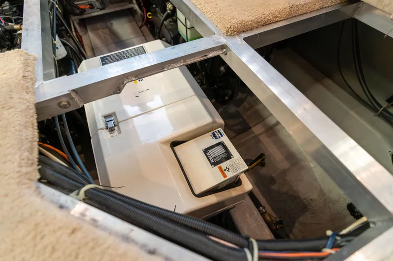 Slide: The Image of Engine compartment of a 1998 Carver 355 Aft Cabin boat, showing mechanical components. - 47