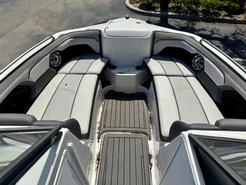 Slide: The Image of 2017 Yamaha Boats 212 Limited S interior with spacious seating and sleek design. - 11