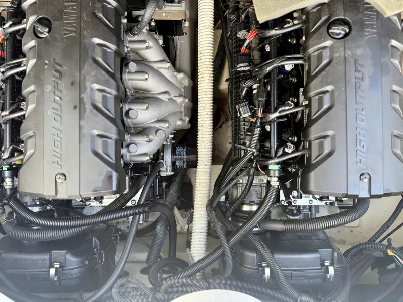 Slide: The Image of 2017 Yamaha Boats 212 Limited S engine compartment with high output engines and wiring. - 12