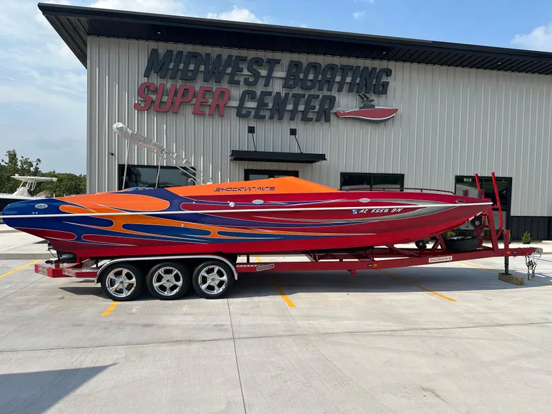 Slide: The Image of 2008 Shockwave Fundeck boat with vibrant design at Midwest Boating Super Center. - 1