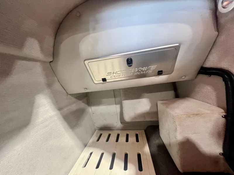 Slide: The Image of 2008 Shockwave Fundeck interior storage compartment with custom boat branding. - 24