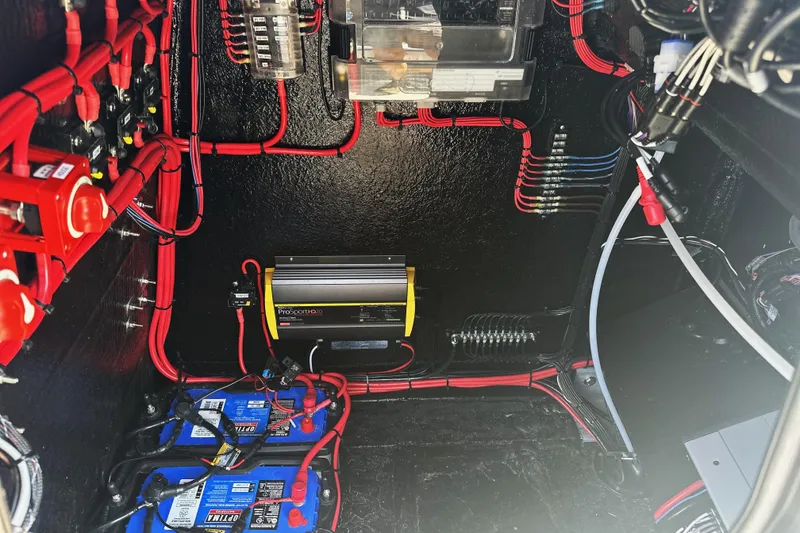 Slide: The Image of 2025 East Cape 25 Open boat electrical system with batteries and wiring. - 12