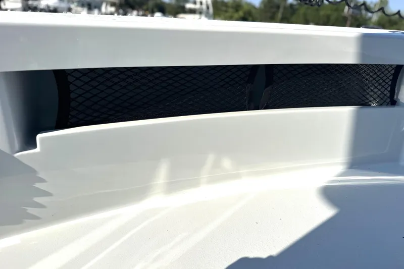Slide: The Image of 2025 East Cape 25 Open boat detail with black mesh storage compartment. - 14