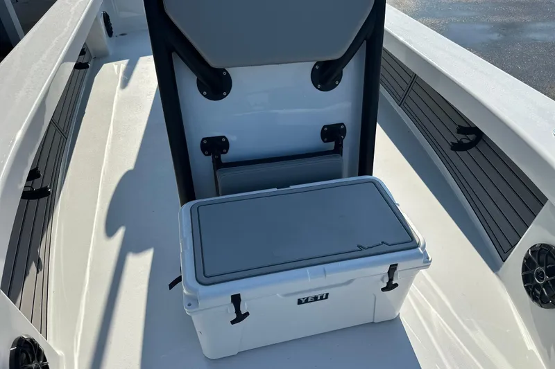 Slide: The Image of 2025 East Cape 25 Open boat interior with Yeti cooler and seating. - 15