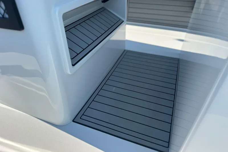 Slide: The Image of 2025 East Cape 25 Open boat interior with sleek, modern design and non-slip flooring. - 26