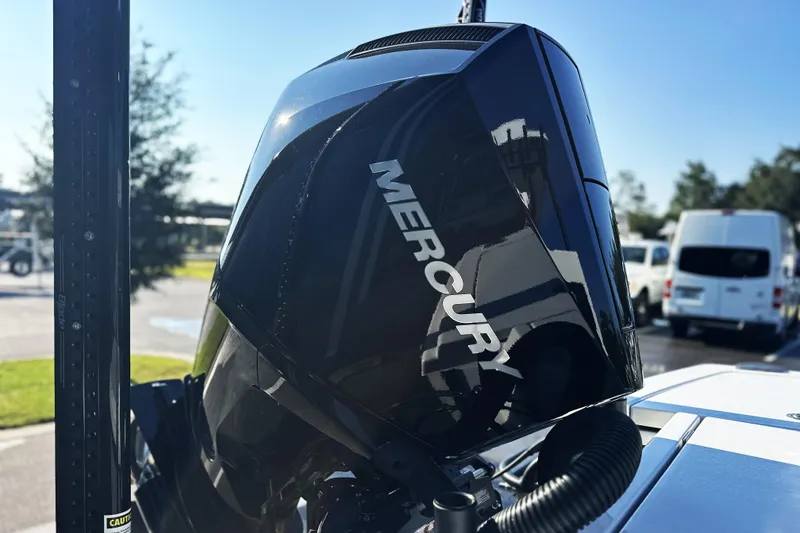 Slide: The Image of Mercury outboard motor on 2025 East Cape 25 Open boat, parked outdoors. - 32