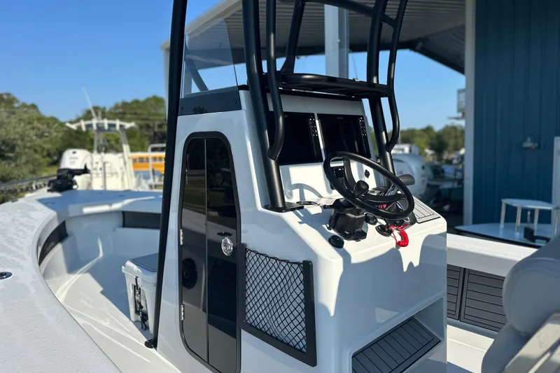 Slide: The Image of 2025 East Cape 25 Open boat cockpit with steering wheel and control panel. - 35