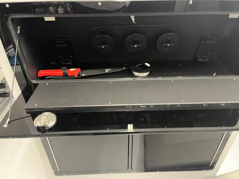 Slide: The Image of Storage compartment of 2025 East Cape 25 Open boat with tools and equipment. - 5